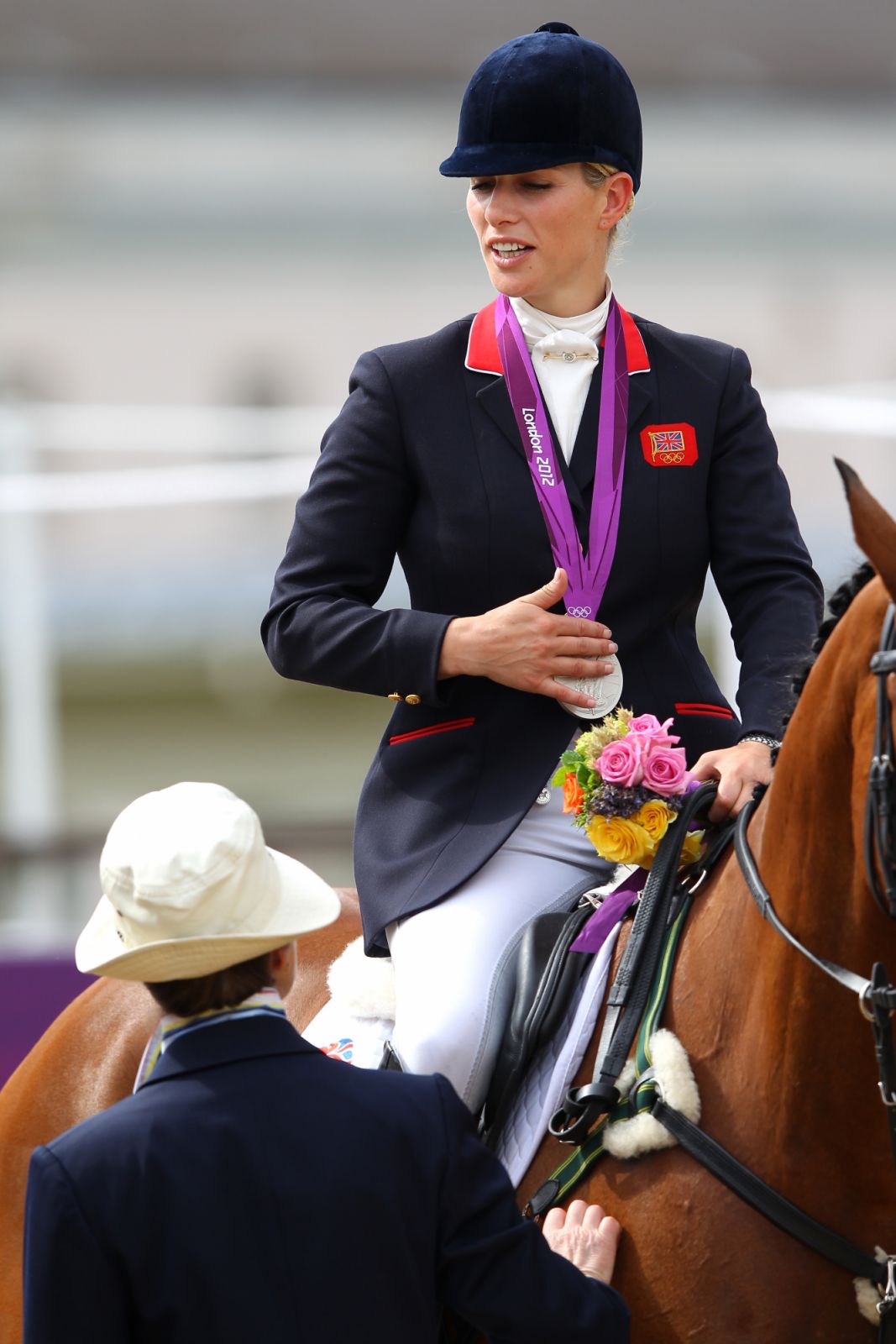 LONDON, ENGLAND - JULY 31:  Zara Phillips riding High Kingdom speaks to her mother, Princess Anne, Princess Royal after receiving a silver medal after the Eventing Team Jumping Final Equestrian event on Day 4 of the London 2012 Olympic Games at Greenwich Park on July 31, 2012 in London, England.  (Photo by Alex Livesey/Getty Images)