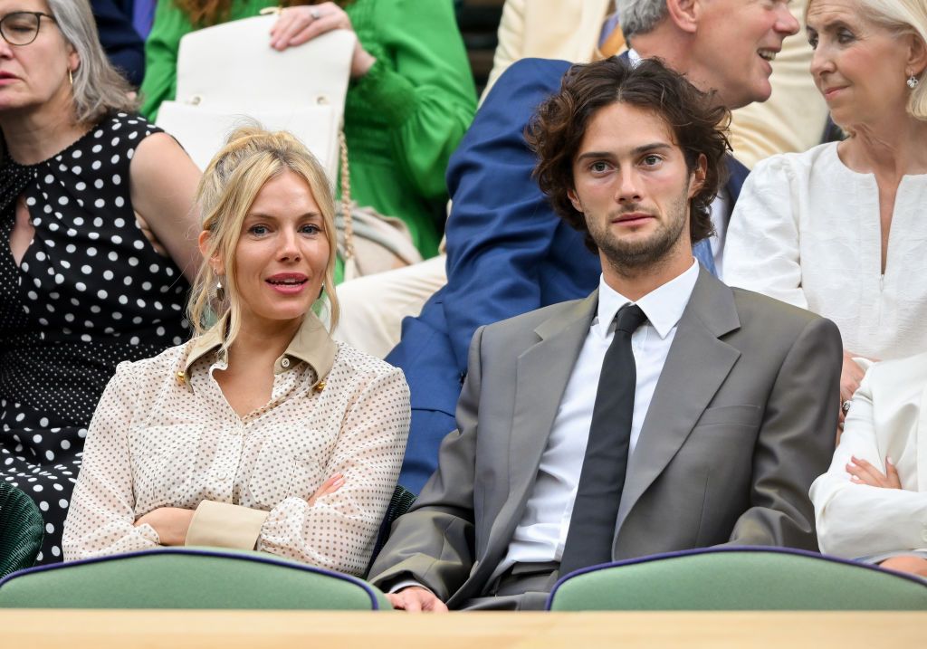 LONDON, ENGLAND - JULY 09: Sienna Miller and Oli Green attend day nine of the Wimbledon Tennis Championships at the All England Lawn Tennis and Croquet Club on July 09, 2024 in London, England. (Photo by Karwai Tang/WireImage)