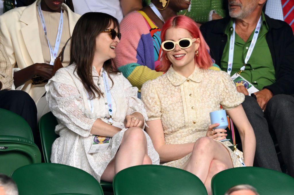 LONDON, ENGLAND - JULY 01: (R)Lucy Boynton attends day one of the Wimbledon Tennis Championships at the All England Lawn Tennis and Croquet Club on July 01, 2024 in London, England. (Photo by Karwai Tang/WireImage)