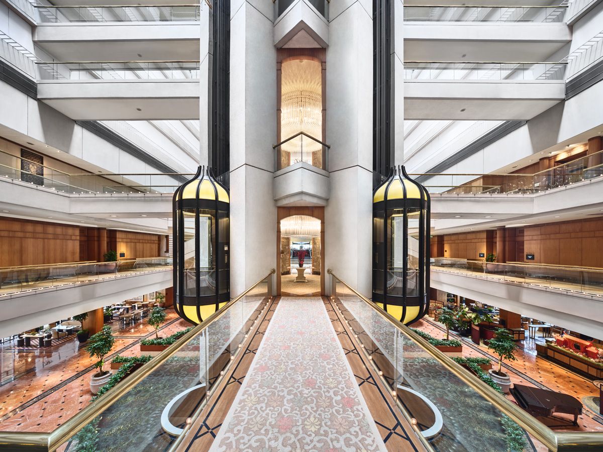 Art Deco-style bubble elevators feature in the hotel lobby