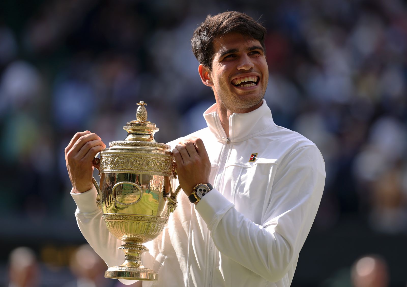 LONDON, ENGLAND - JULY 14: Carlos Alcaraz of Spain celebrates with the trophy after defeating Novak Djokovic of Serbia in the Gentlemen's Singles Final during day fourteen of The Championships Wimbledon 2024 at All England Lawn Tennis and Croquet Club on July 14, 2024 in London, England. (Photo by Julian Finney/Getty Images)