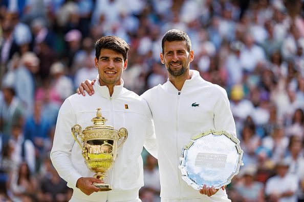 LONDON, ENGLAND - JULY 14: Carlos Alcaraz of Spain andr Novak Djokovic of Serbia pose with their trophies after the final of the men's singles, during day fourteen of The Championships Wimbledon 2024 at All England Lawn Tennis and Croquet Club on July 14, 2024 in London, England. (Photo by Frey/TPN/Getty Images)