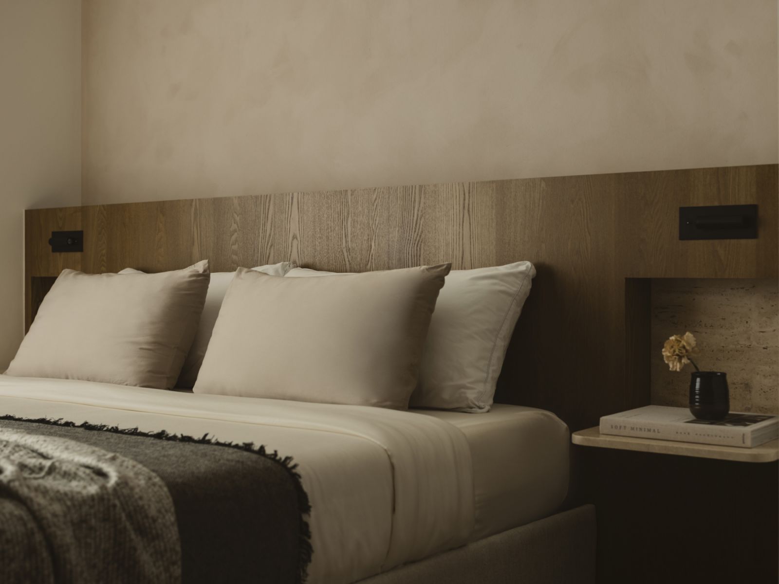 Close-up of the master bedroom headboard, including sleek side panels for bedside displays