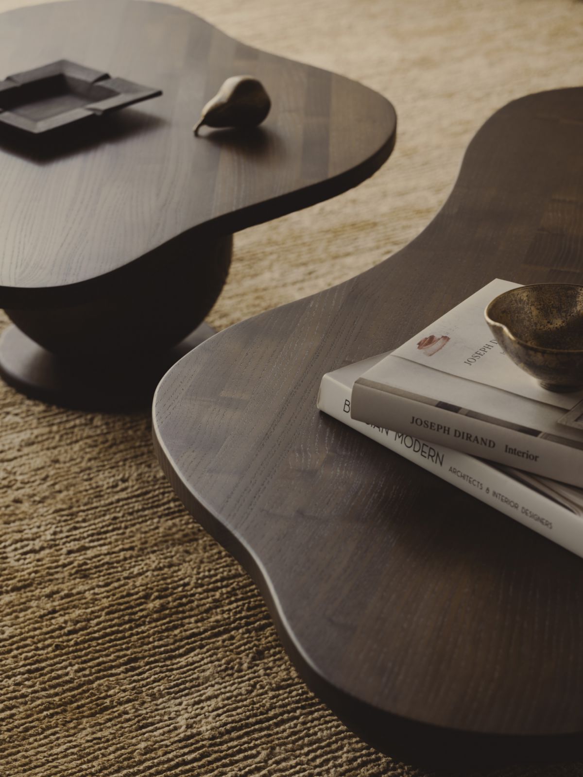 Curvilinear coffee tables with timber balls for feet