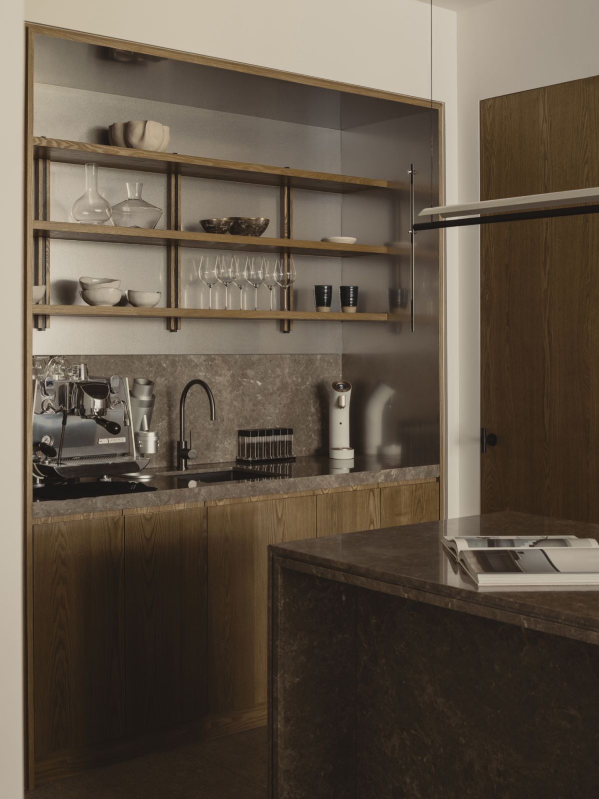 A close-up of the open-plan dry kitchen, giving easy access to varied beverage options