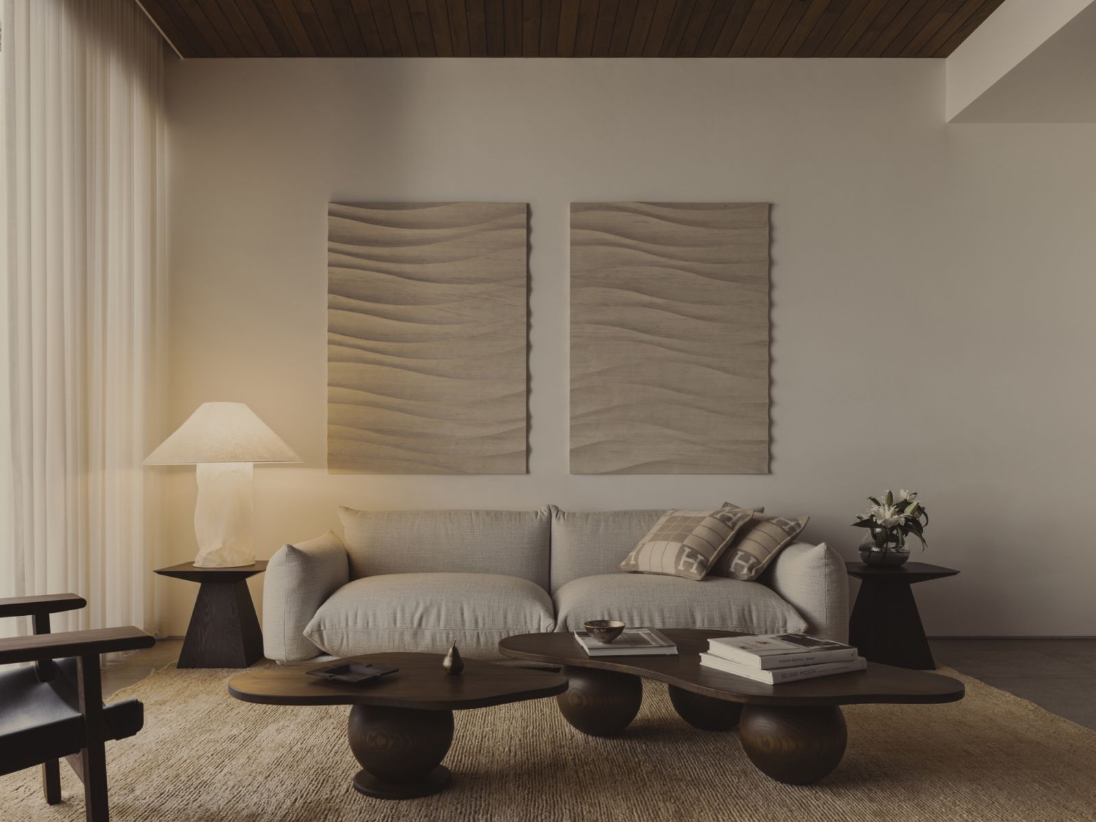 The living area showcases the melding of bespoke and tactfully chosen pieces to lend character to the space