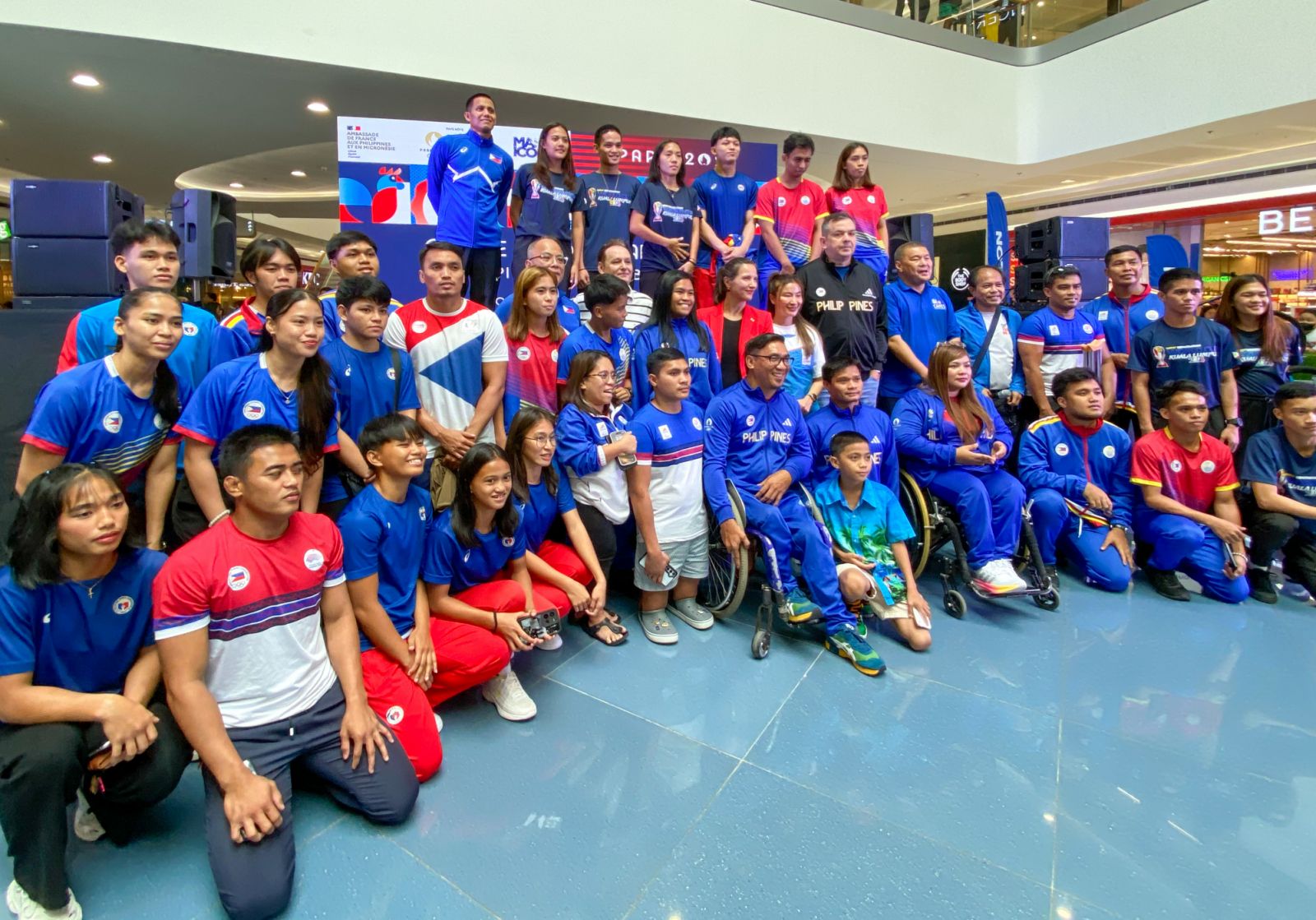 Guests pose for a photo during the launch of ‘On the Road to Paris 2024 - Olympics Sports Hub and French Street Food Fair’ at SM Mall of Asia in Pasay City