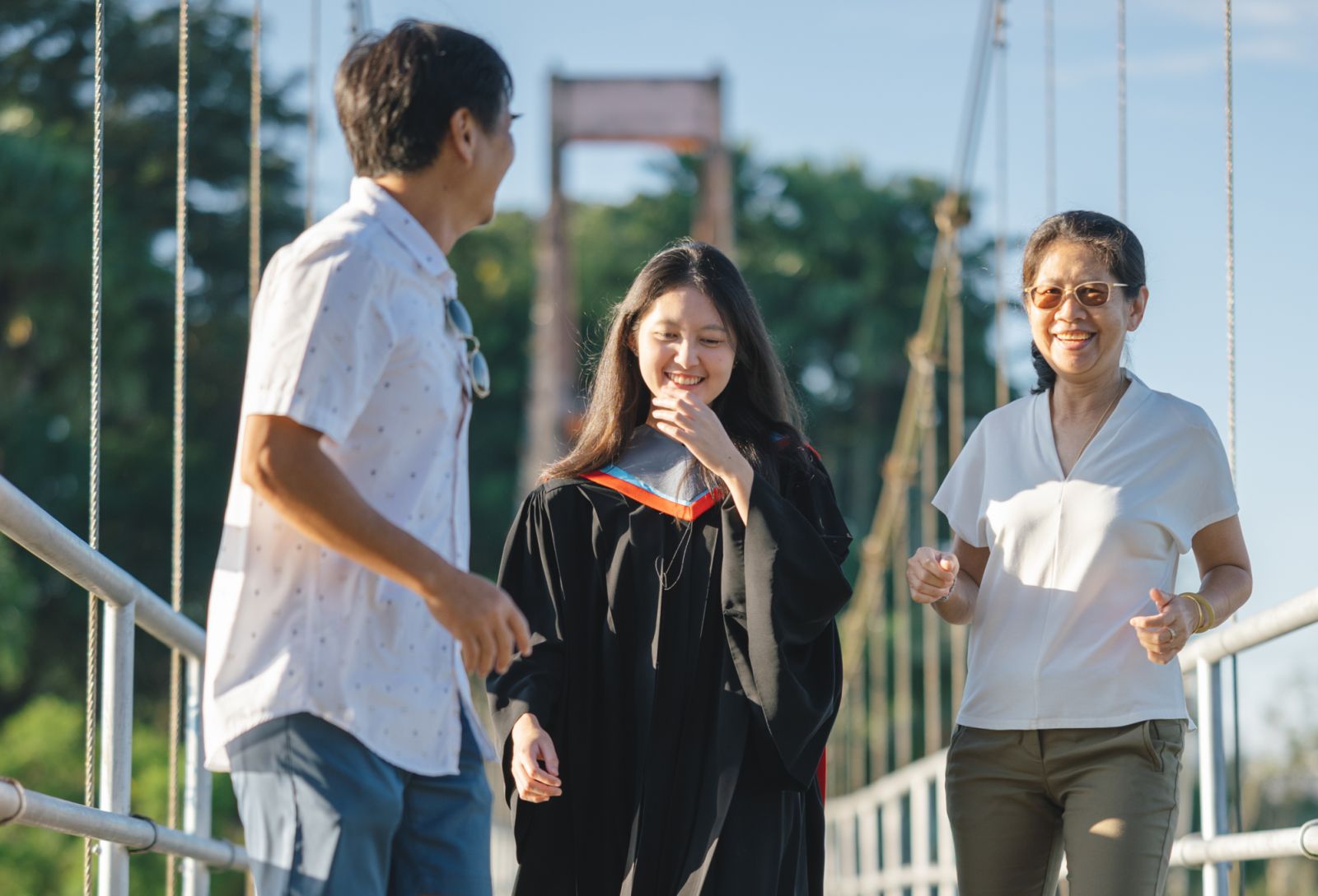 Gen z Graduate Photoshoot Portrait with lovely asia family at park