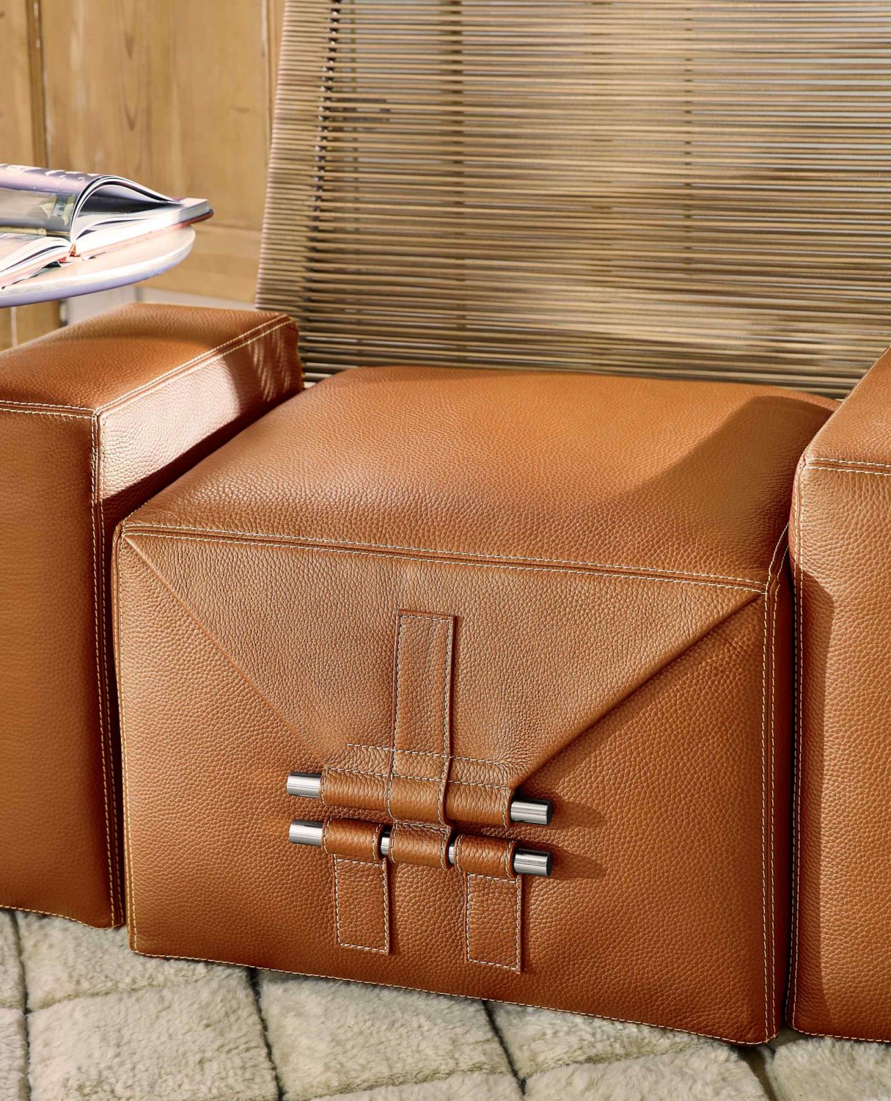 The design evokes the aesthetics of a luggage or a gift bundled in wrapping paper