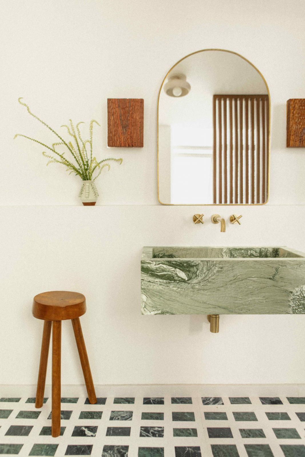 The bathroom with verdi alpi marble inlaid into the terrazzo floor (Photo: Maureen M Evans)