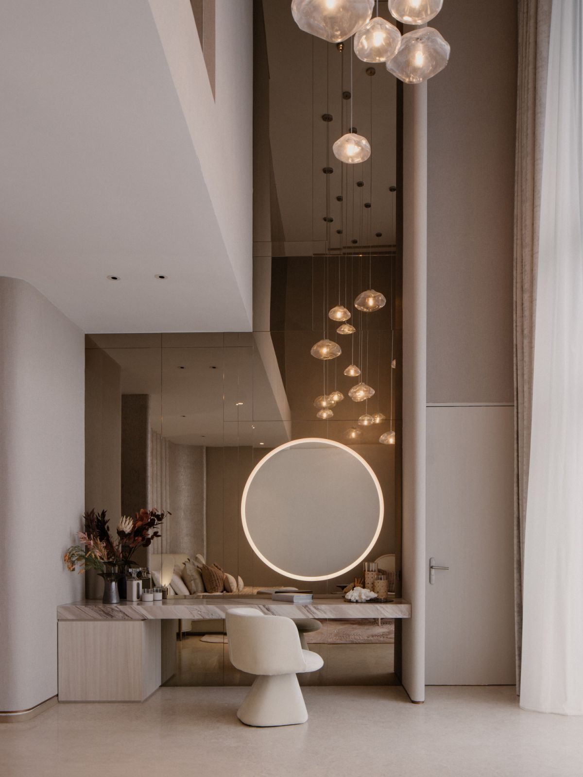 Floating glass chandeliers dot the master suite's ceilings