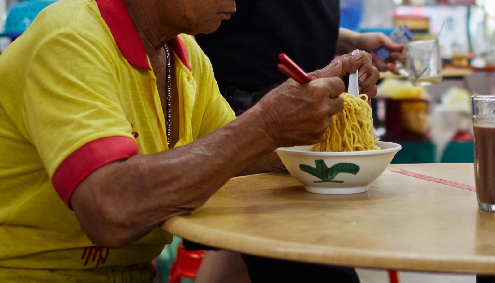 A customer at a kopitiam in Penang (Photo: Unsplash)