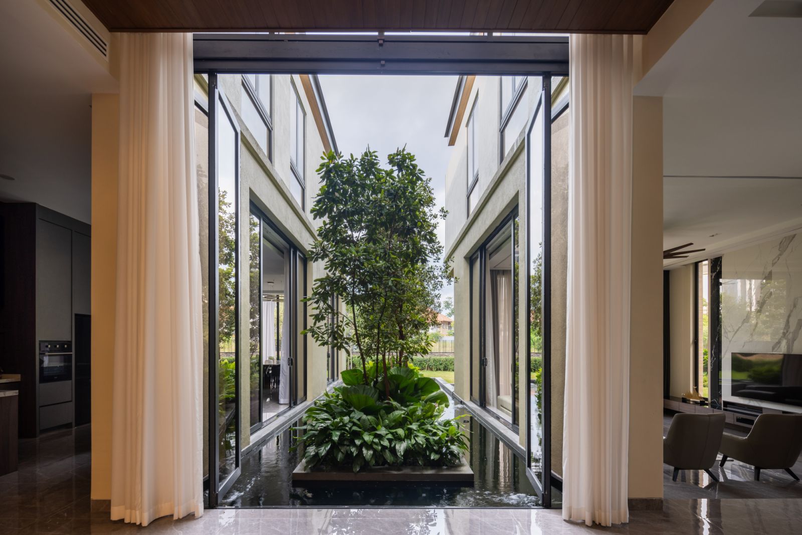 The central courtyard features lush landscaping
