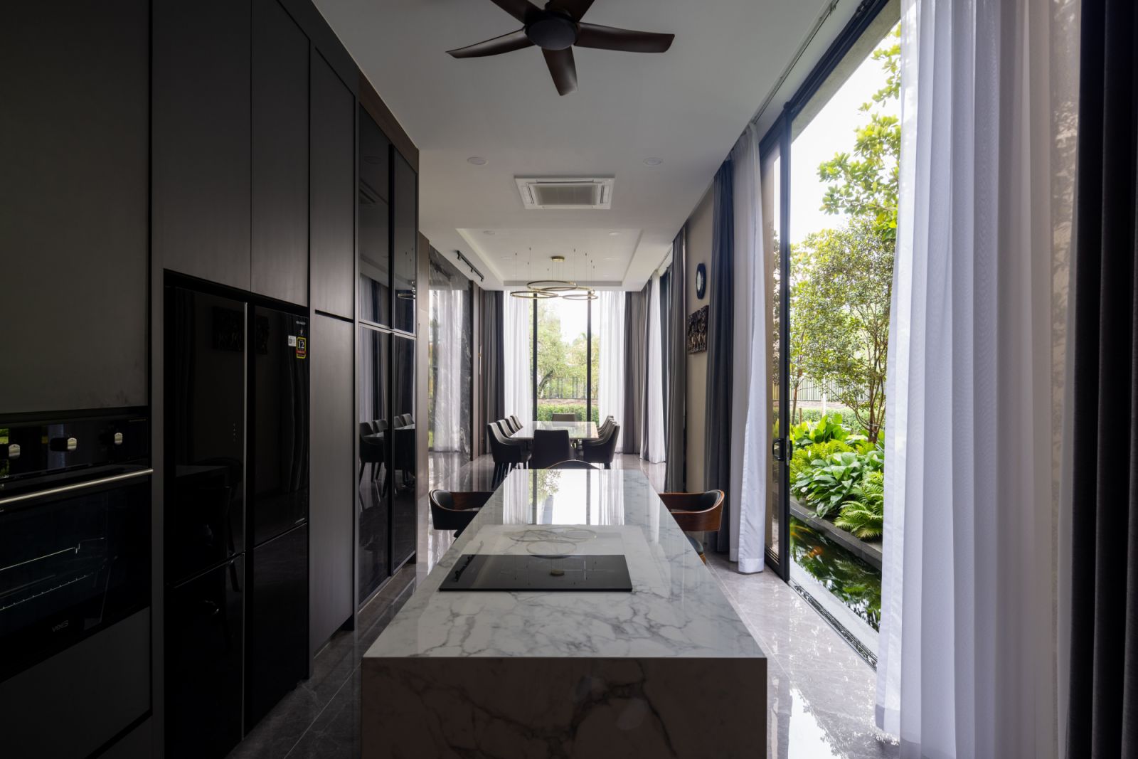 Cooking and dining spaces look out to greenery