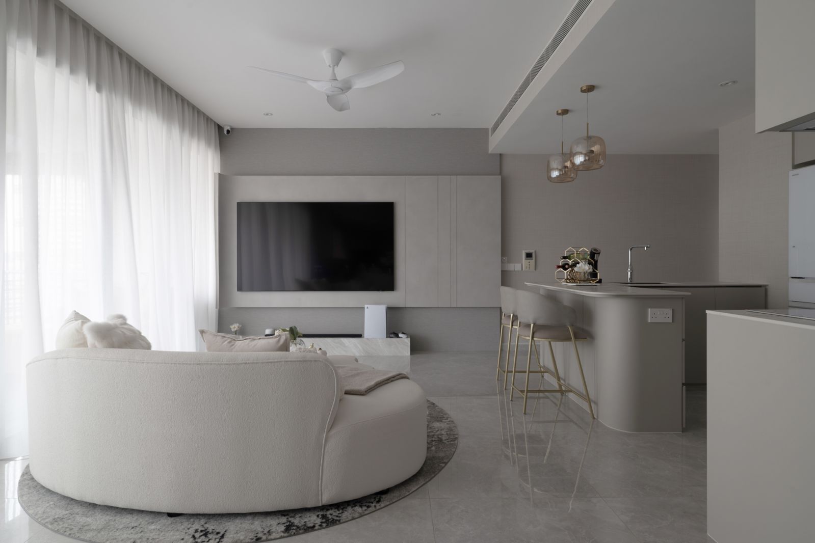 The Ascentia Sky living room with its signature curved feature wall