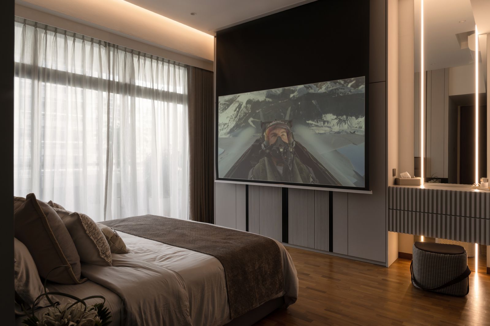 A hidden screen slides into view in the Regency Park bedroom