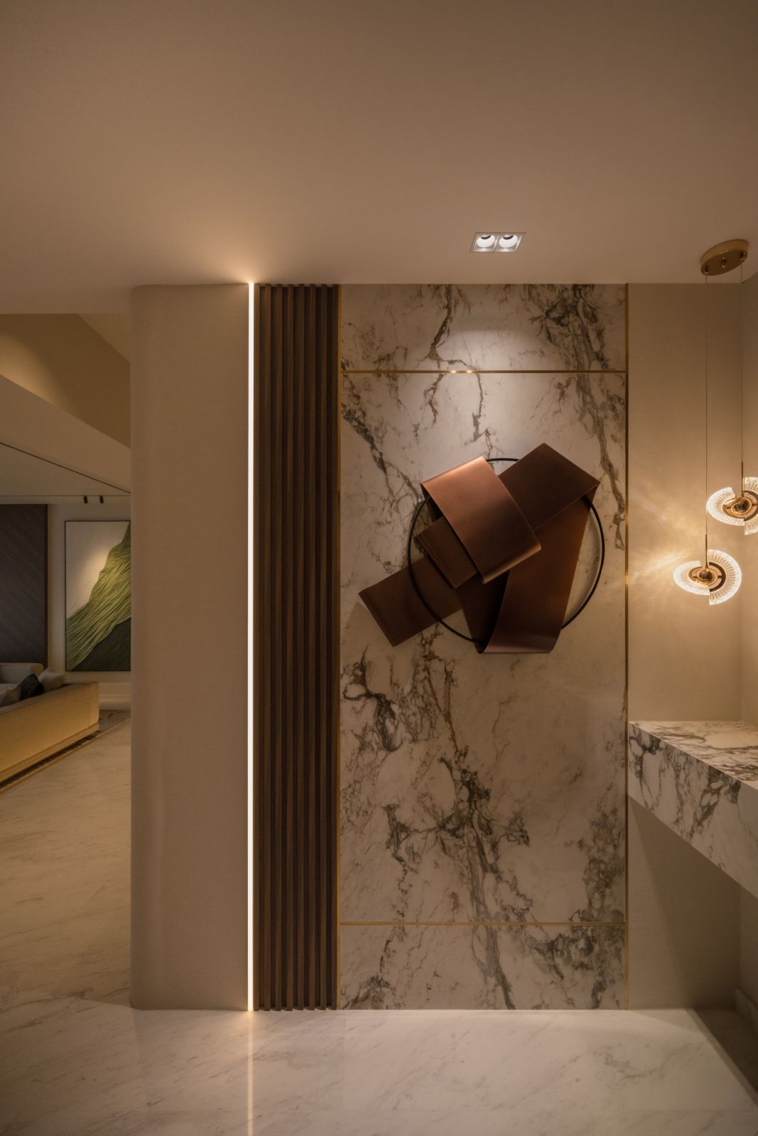 The apartment’s carefully curated lighting and artwork