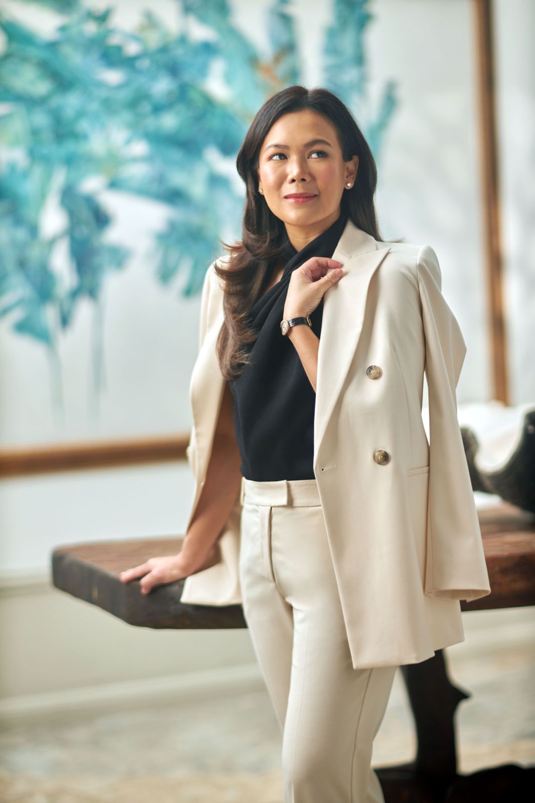 Jet Acuzar suits up for an event, wearing her Cartier Baignoire watch