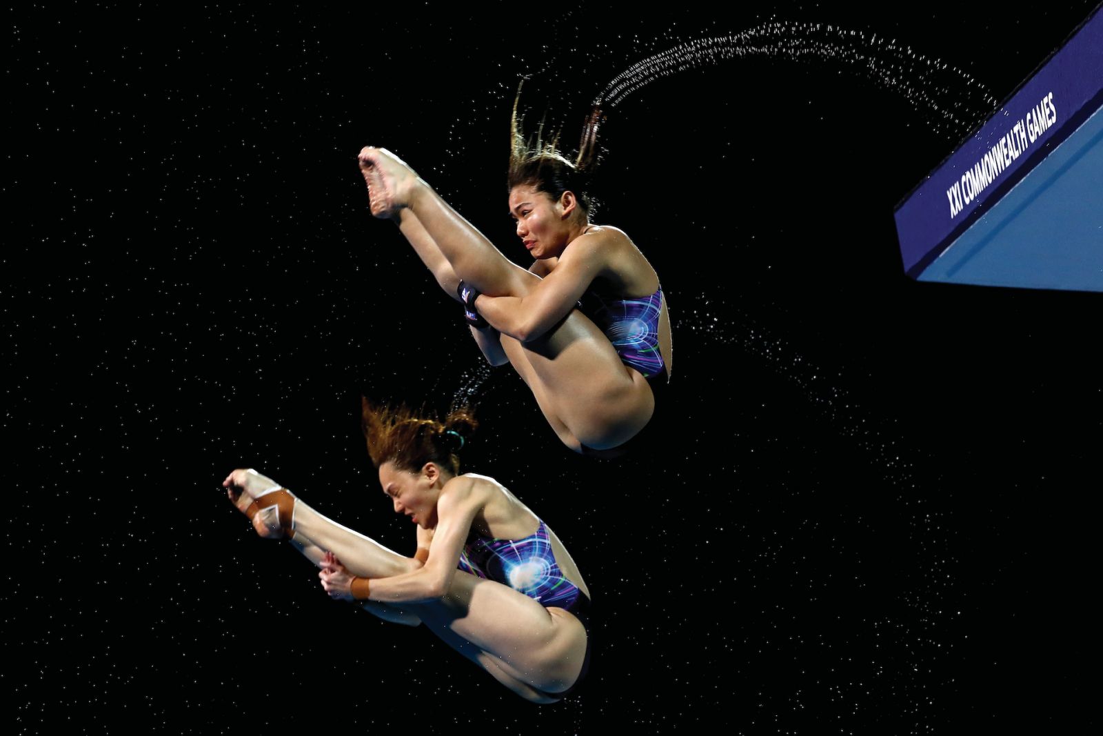 GOLD COAST, AUSTRALIA - APRIL 11: Mun Yee Leong and Nur Dhabitah Sabri of Malaysia compete in the Women's Synchronised 10m Platform Diving Final on day seven of the Gold Coast 2018 Commonwealth Games at Optus Aquatic Centre on April 11, 2018 on the Gold Coast, Australia. (Photo by Clive Rose/Getty Images)