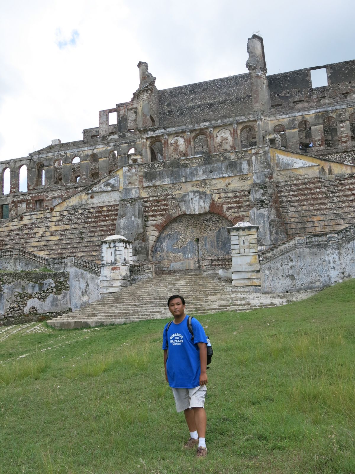 Lam stands in front of Sans Souci Palace, a former royal residence in north of Haiti (Photo: Alfred Lam)