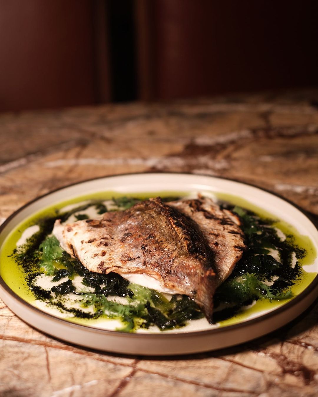 Whole charcoal grilled baby bass from Yellow Fin Horse (Photo: Instagram / @yellowfinhorse)