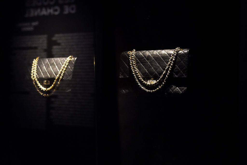 PARIS, FRANCE - OCTOBER 13: Chanel 2.55 black leather quilted bags are seen, during the "Gabrielle Chanel - Manifeste de Mode" (fashion manifesto) exhibition, during the Picto Awards 2020 at Palais Galliera on October 13, 2020 in Paris, France. (Photo by Edward Berthelot/Getty Images)