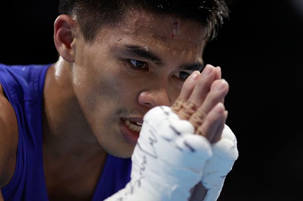 Carlo Paalam of Team Philippines celebrates victory over Ryomei Tanaka of Team Japan during the Men's Fly (48-52kg) semi final on day thirteen of the Tokyo 2020 Olympic Games at Kokugikan Arena in Tokyo, Japan. (Photo: Ueslei Marcelino - Pool/Getty Images)