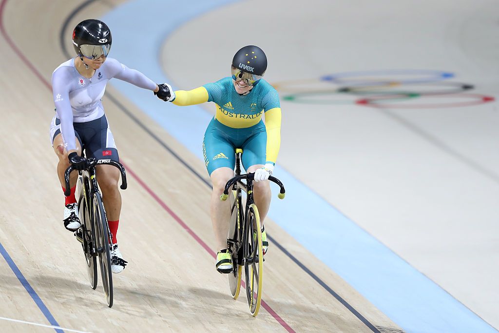 Hong Kong cyclist Lee and Australian cyclist Anna Meares hold hands after competing in the women's track sprint at the 2016 Rio Summer Olympics (Photo: Getty Images)