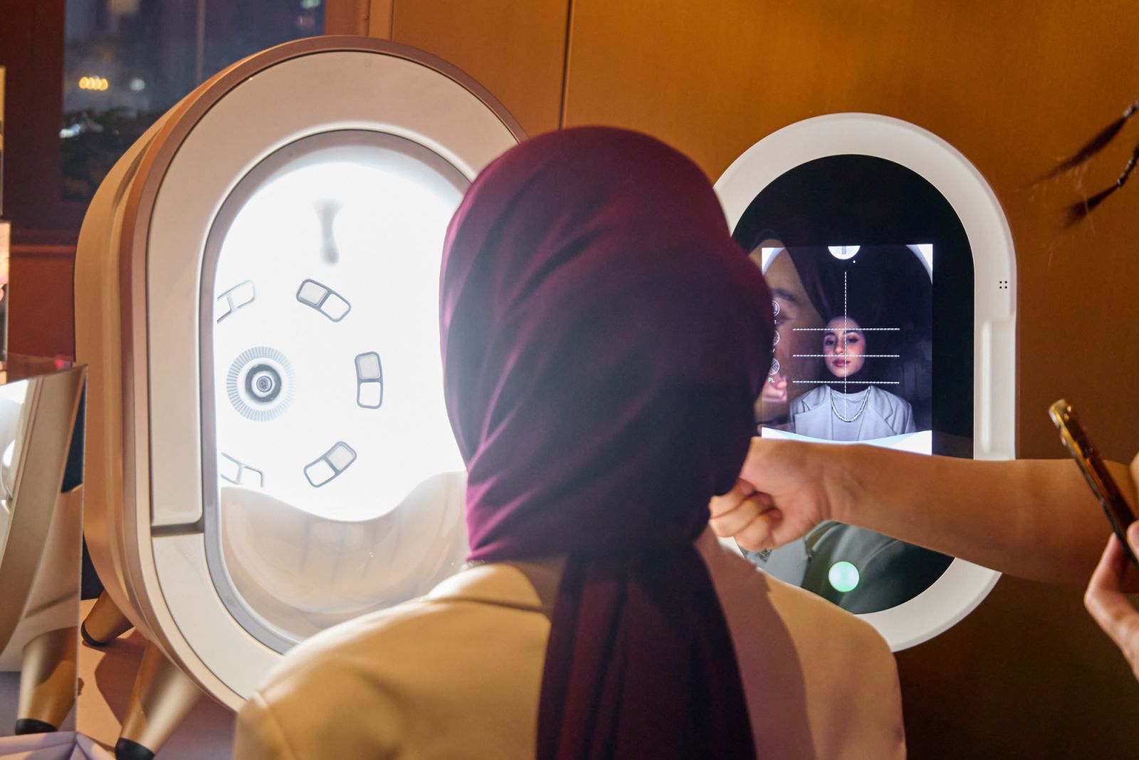 Tasnim Shah engaged in a skin analysis