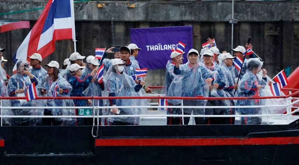 PARIS, FRANCE - JULY 26: Athletes in the delegation of Thailand aboard a boat in the floating parade on the river Seine during the Opening Ceremony of the Olympic Games Paris 2024 on July 26, 2024, in Paris, France. (Photo by Clodagh Kilcoyne - Pool/Getty Images)