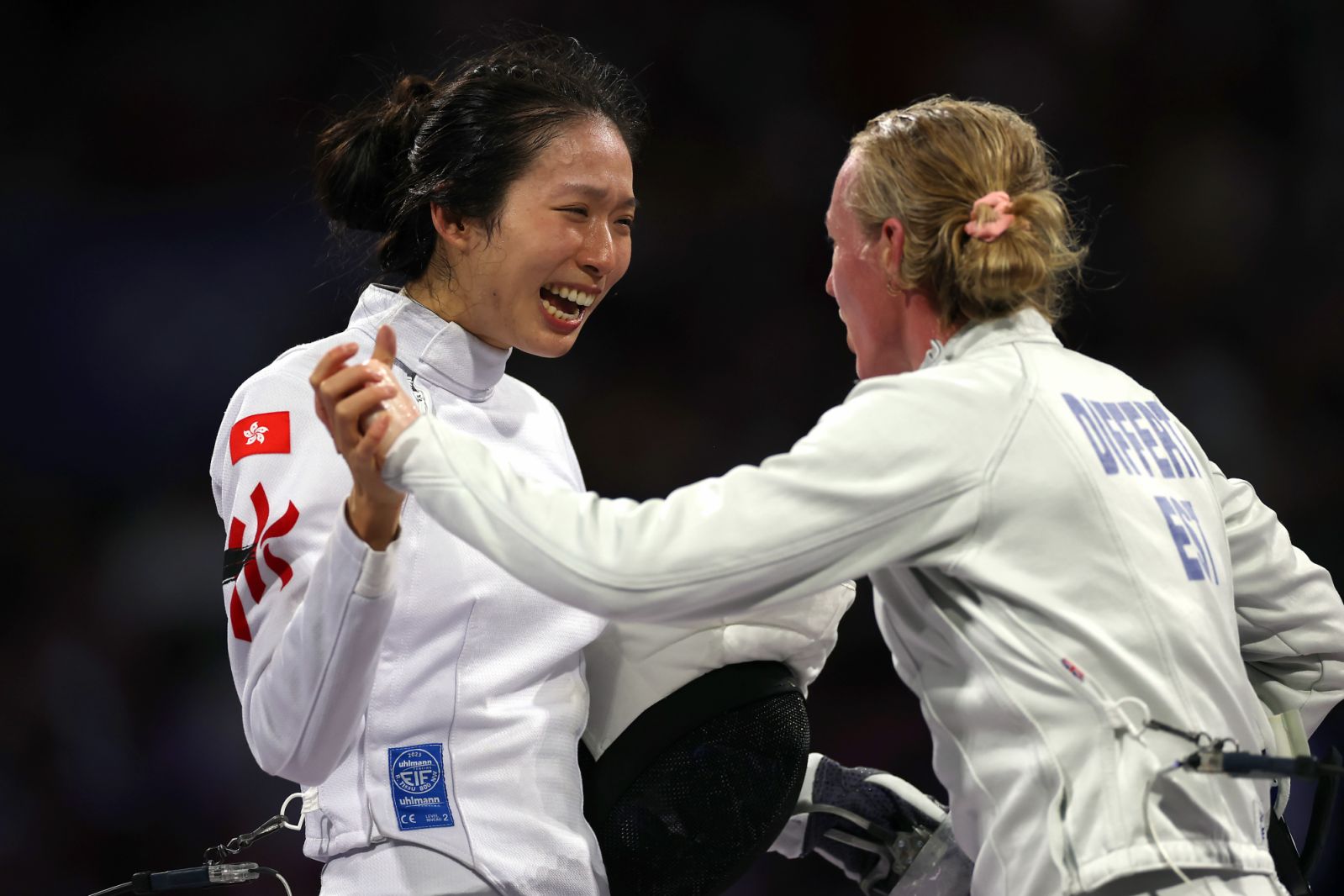 PARIS, FRANCE - JULY 27: Man Wai Vivian Kong of Team Hong Kong is congratulated by Nelli Different of Team Estonia after winning the Women's Épée Individual Semifinal 1 between Man Wai Vivian Kong of Team Hong Kong and Nelli Different of Team Estonia on day one of the Olympic Games Paris 2024 at Grand Palais on July 27, 2024 in Paris, France. (Photo by Patrick Smith/Getty Images)