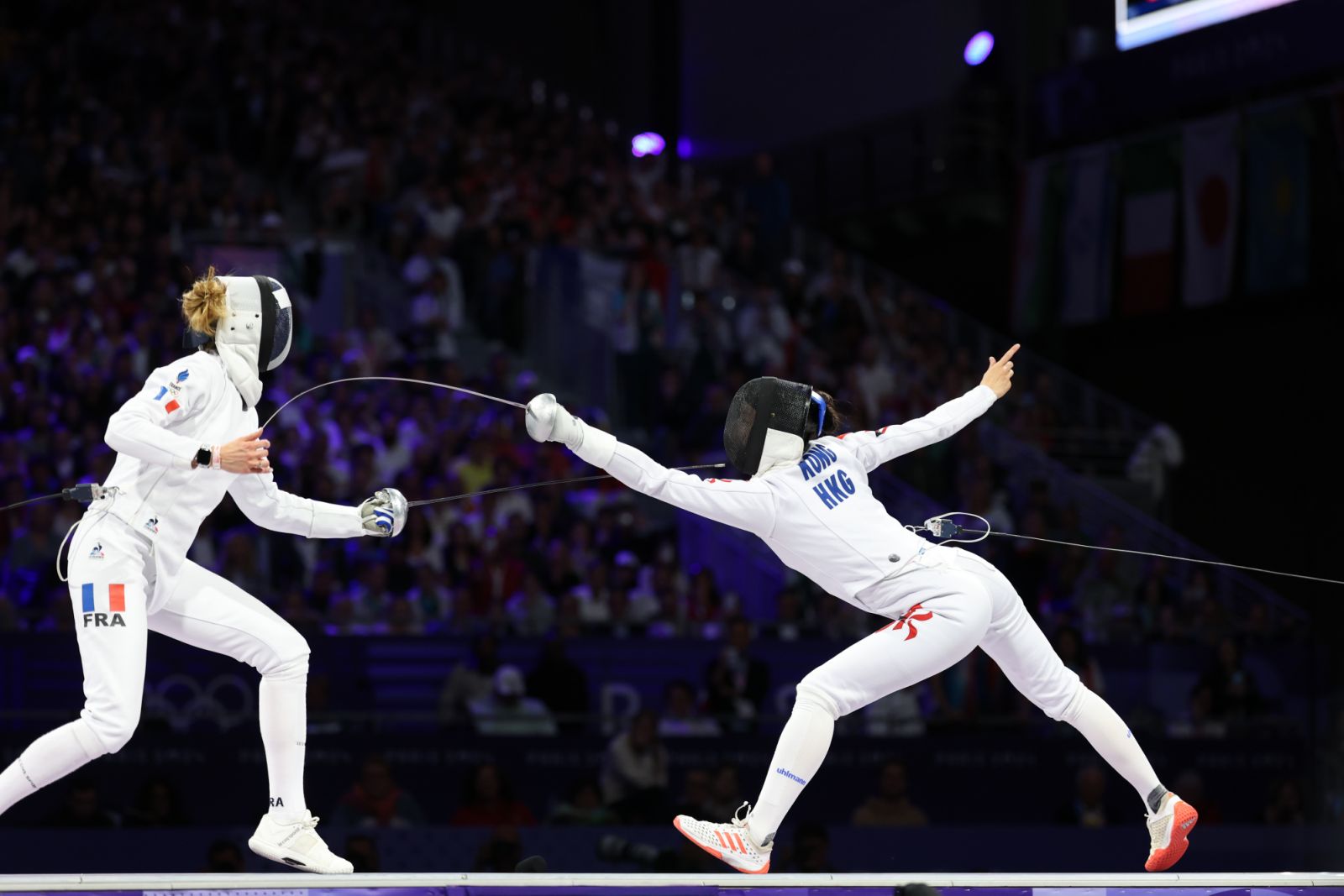 PARIS, FRANCE - JULY 27: Kong Man Wai Vivian (R) of Team Chinese Hong Kong competes against Auriane Mallo Breton of Team France during the Women's Epee Individual Final on day 1 of the Paris 2024 Olympic Games at the Grand Palais on July 27, 2024 in Paris, France. (Photo by Sheng Jiapeng/China News Service/VCG via Getty Images)