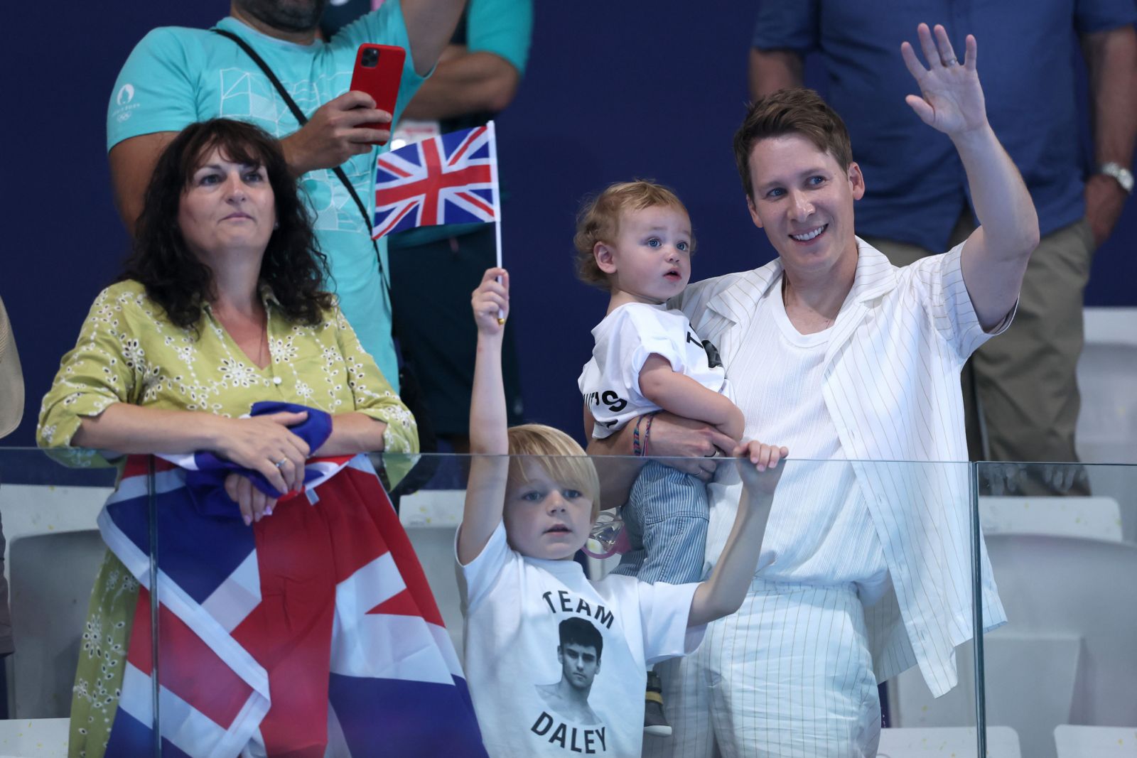 PARIS, FRANCE - JULY 29: Debbie Daley, mother of Thomas Daley, Dustin Lance Black, husband of Thomas Daley, and their children are seen in attendance as they show their support ahead of the Men’s Synchronised 10m Platform Final on day three of the Olympic Games Paris 2024 at Aquatics Centre on July 29, 2024 in Paris, France. (Photo by Clive Rose/Getty Images)