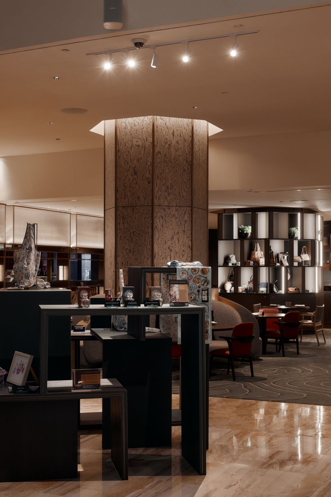 Long, sleek lines are accentuated by metallic inlays, evoking the silhouette of the Singapore skyline