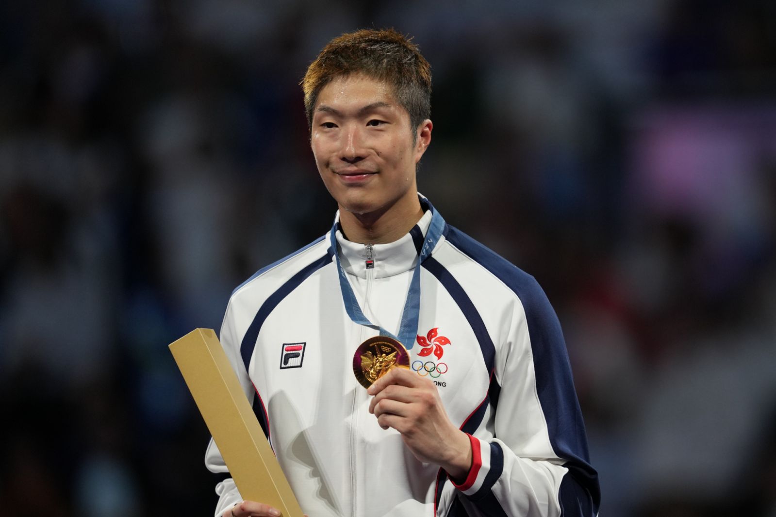 PARIS, FRANCE - JULY 29: Cheung Ka Long of Hong Kong poses with gold medal after winning against Filippo Macchi (not seen) of Italy in the Men's Fencing Foil Individual Final on day three of the Olympic Games Paris 2024 at Grand Palais in Paris, France on July 29, 2024. (Photo by Mustafa Ciftci/Anadolu via Getty Images)