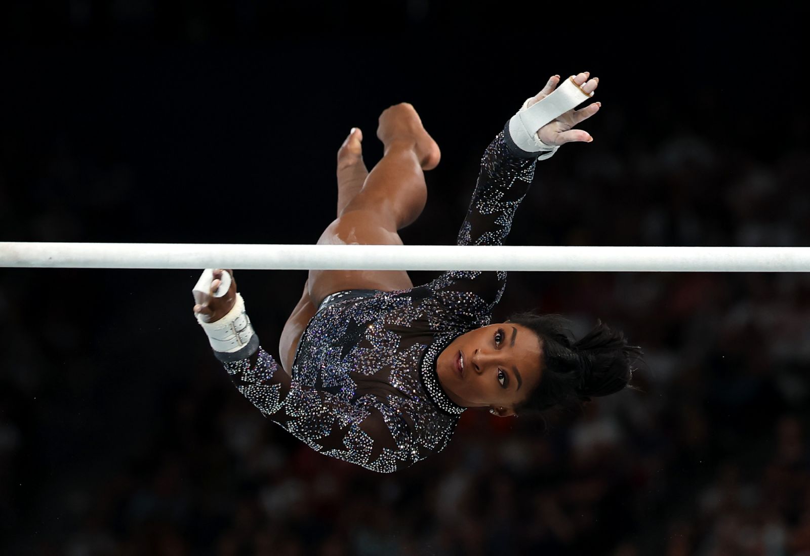 PARIS, FRANCE - JULY 28: Simone Biles of Team United States competes on the uneven bars during the Artistic Gymnastics Women's Qualification on day two of the Olympic Games Paris 2024 at Bercy Arena on July 28, 2024 in Paris, France. (Photo by Naomi Baker/Getty Images)
