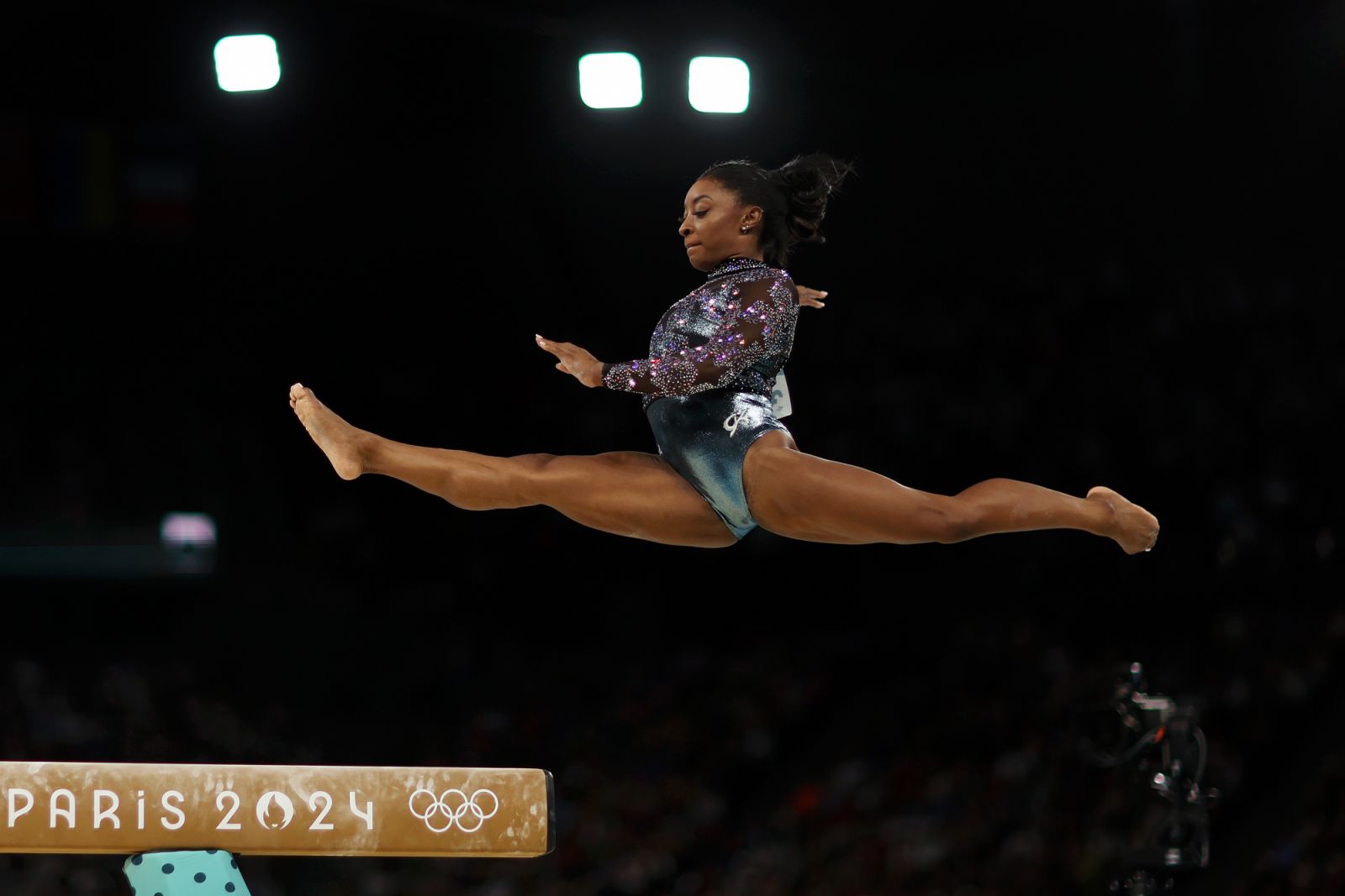 PARIS, FRANCE - JULY 28: Simone Biles of Team USA competes on the beam during the Women's Artistic Gymnastics Qualification on day two of the Olympic Games Paris 2024 at Bercy Arena on July 28, 2024 in Paris, France. (Photo by Naomi Baker/Getty Images)