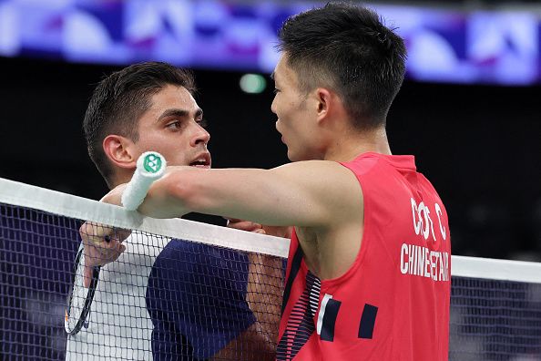 Taiwan's Chou Tien-chen speaks with Mexico's Luis Ramon Garrido after the men's singles badminton group stage match during the Paris 2024 Olympic Games at Porte de la Chapelle Arena in Paris on July 28, 2024. (Photo by David GRAY / AFP) (Photo by DAVID GRAY/AFP via Getty Images)