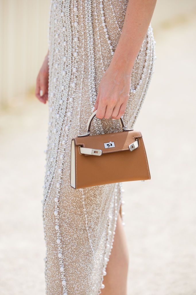 PARIS, FRANCE - JUNE 26: Magda Swider wears long sleeveless dress Vivienna Lorikeet, Hermes bag outside Elie Saab during the Haute Couture Fall/Winter 2024/2025 as part of Paris Fashion Week on June 26, 2024 in Paris, France. (Photo by Christian Vierig/Getty Images)