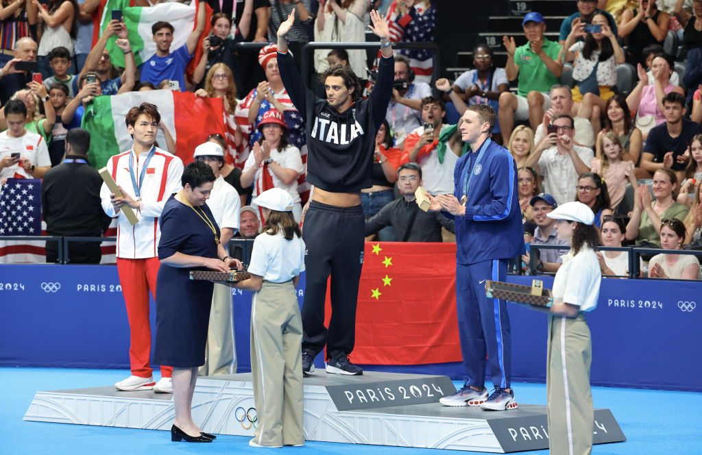 NANTERRE, FRANCE - JULY 29: Thomas Ceccon of Team Italy poses with his medal after winning gold in the Men’s 100m Backstroke Final on day three of the Olympic Games Paris 2024 at Paris La Defense Arena on July 29, 2024 in Nanterre, France. (Photo by Xavier Laine/Getty Images)