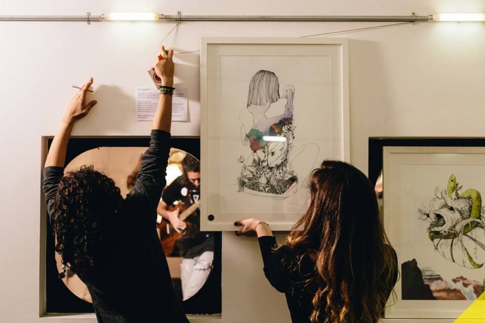 Putting up art at the Haven for Artists in Beirut, Lebanon