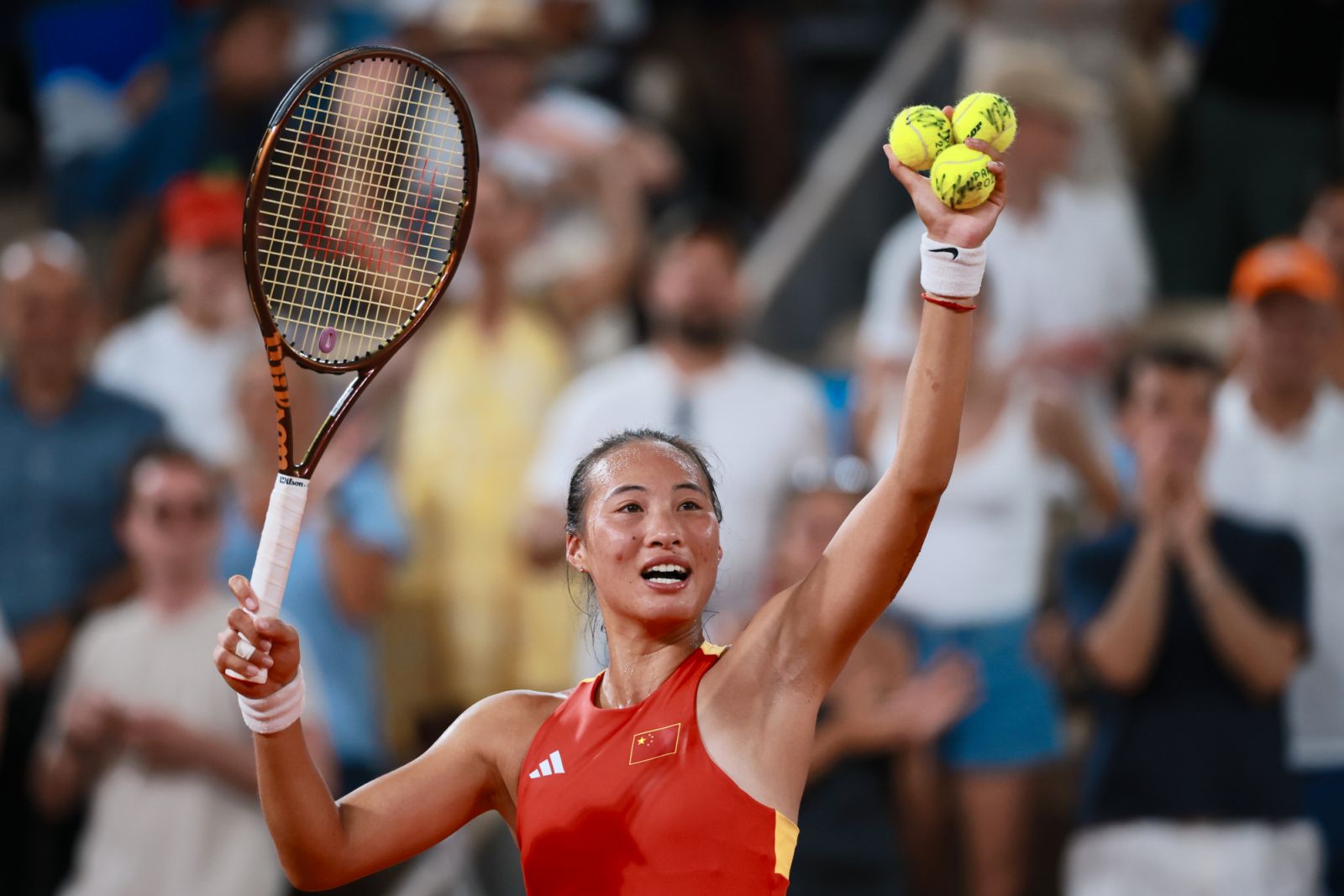 PARIS, FRANCE - JULY 31: Zheng Qinwen of Team China reacts during the Tennis - Women's Singles Quarter-final match against Angelique Kerber of Team Germany on day 5 of the Paris 2024 Olympic Games at Stade Roland-Garros on July 31, 2024 in Paris, France. (Photo by Lu Lin/CHINASPORTS/VCG via Getty Images)