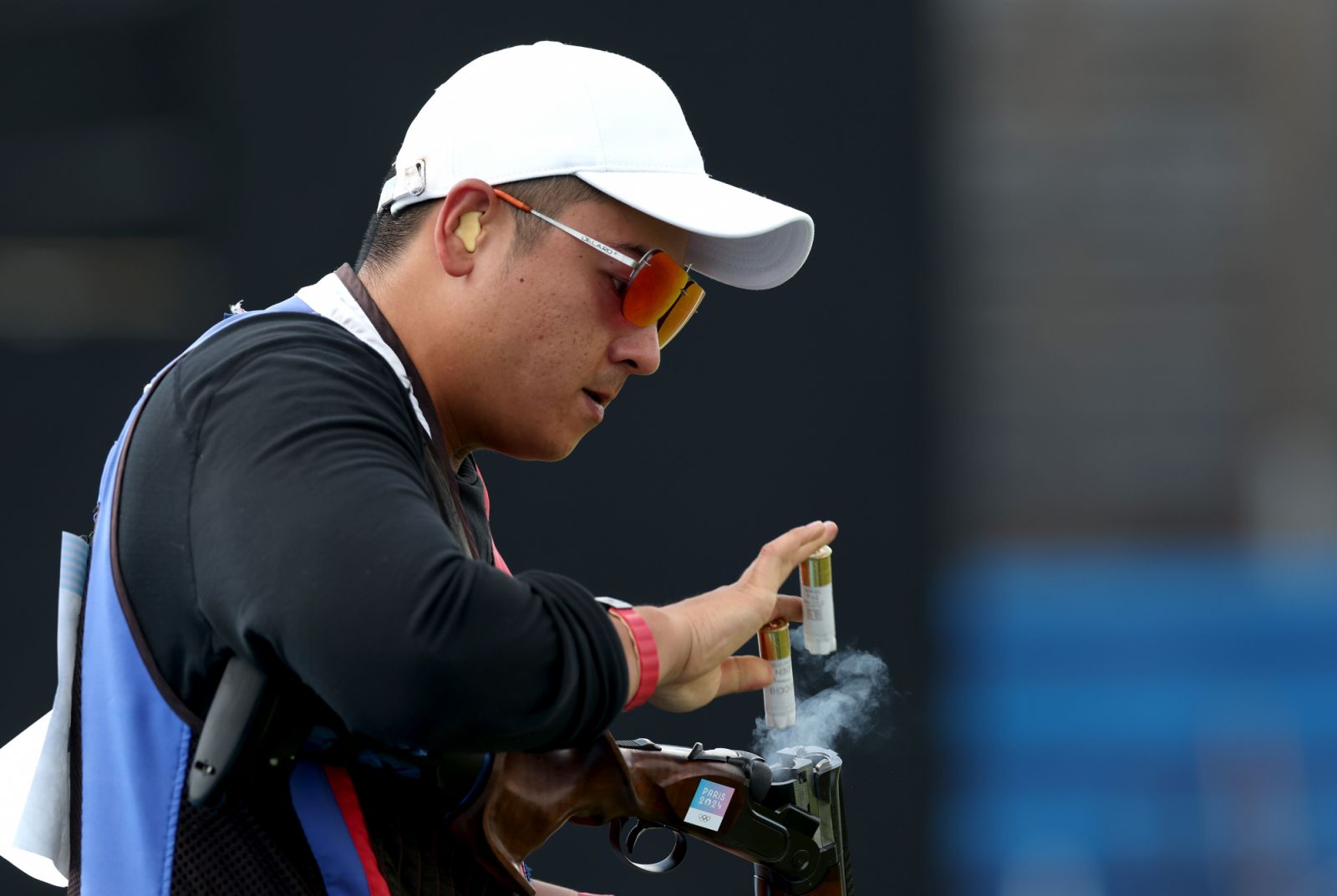CHATEAUROUX, FRANCE - AUGUST 03: Meng Yuan Lee of Team Chinese Taipei releases cartridges while competing in the Shooting Skeet Men's Final on day eight of the Olympic Games Paris 2024 at Chateauroux Shooting Centre on August 03, 2024 in Chateauroux, France. (Photo by Charles McQuillan/Getty Images)