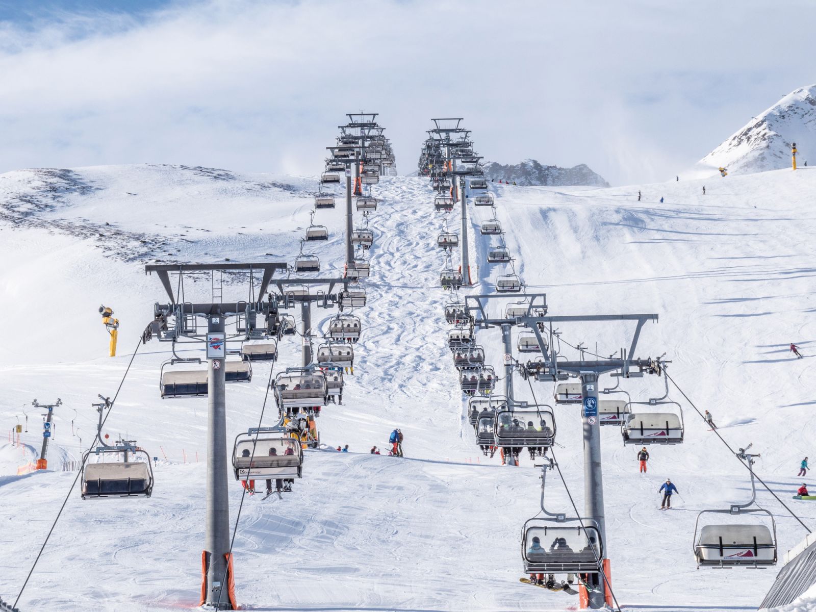 Ski resort with people on the ski lift in the Austrian Alps Soelden region