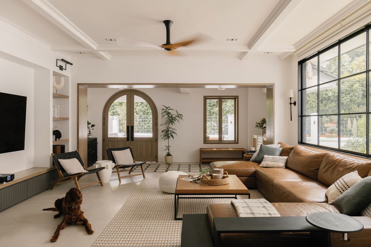 The living room is an airy space replete with well-articulated design details