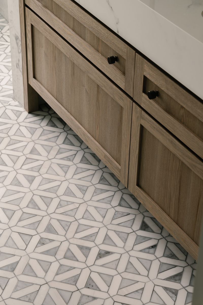Wood and decorative tiles create a pleasing contrast