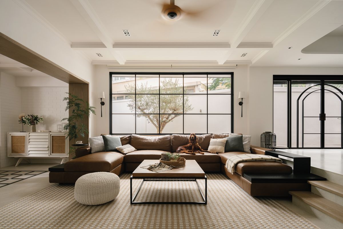 A leather-clad modular sofa is the centrepiece of the living area