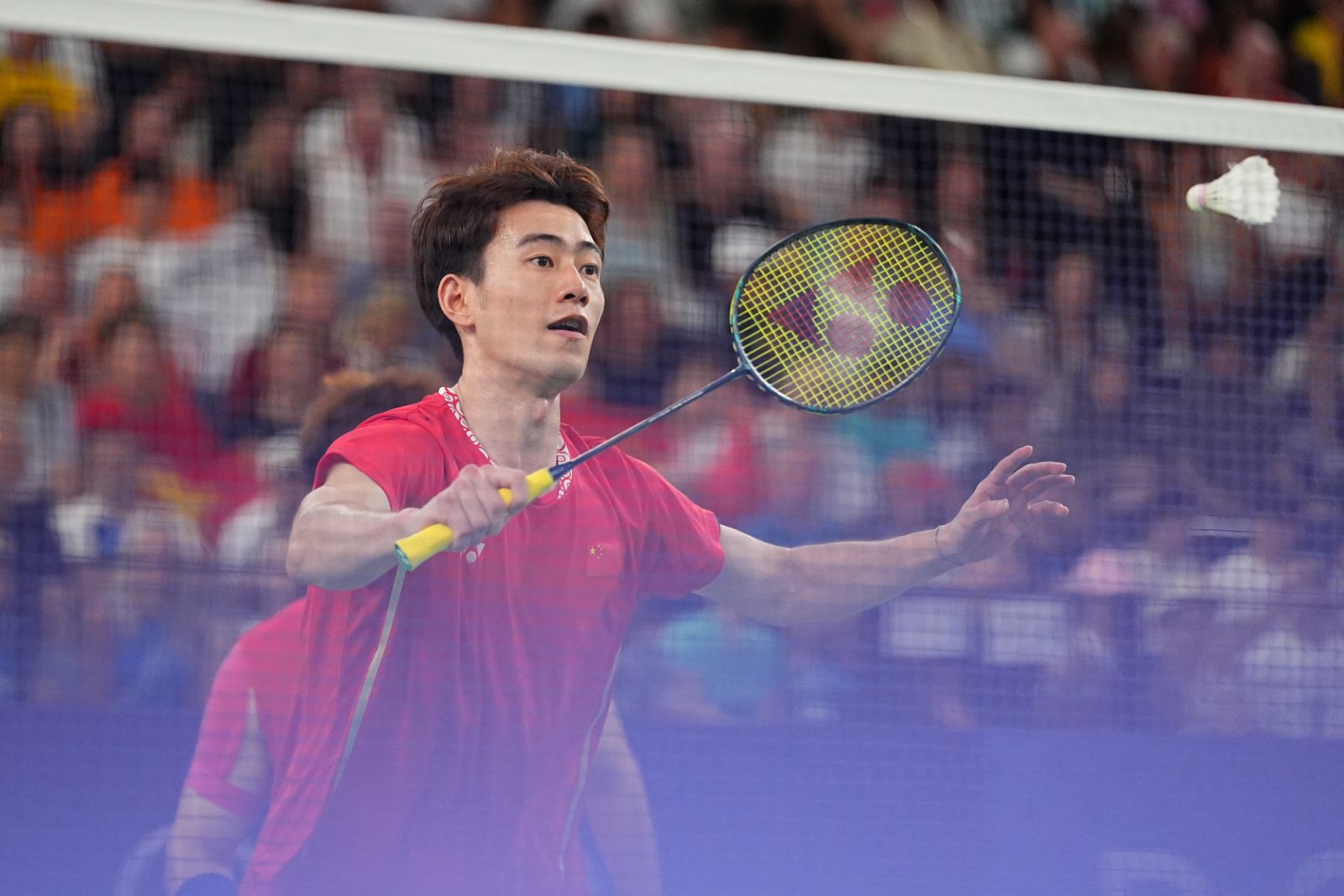 PARIS, FRANCE - AUGUST 04: Wang Chang and Liang Weikeng (not in the picture) of Team China compete during the Badminton - Men's Doubles Gold Medal match against Lee Yang and Wang Chi-lin of Team Chinese Taipei on day nine of the Paris 2024 Olympic Games at Porte de La Chapelle Arena on August 4, 2024 in Paris, France. (Photo by Zhao Wenyu/China News Service/VCG via Getty Images)