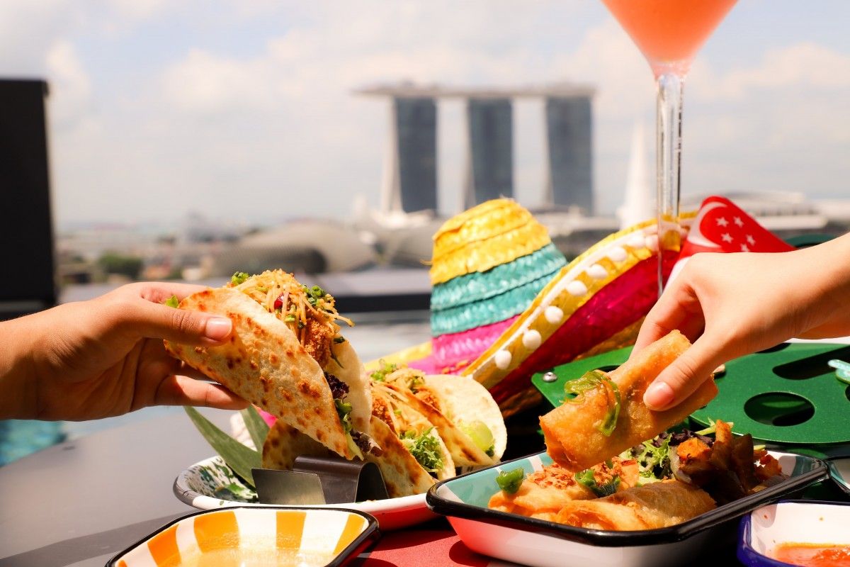 El Chido has put a Singaporean touch on its Mexican classics like the deep-fried chicken rice chimichanga, and the crispy seafood otah tortilla (Photo: El Chido) National Day fireworks restaurant