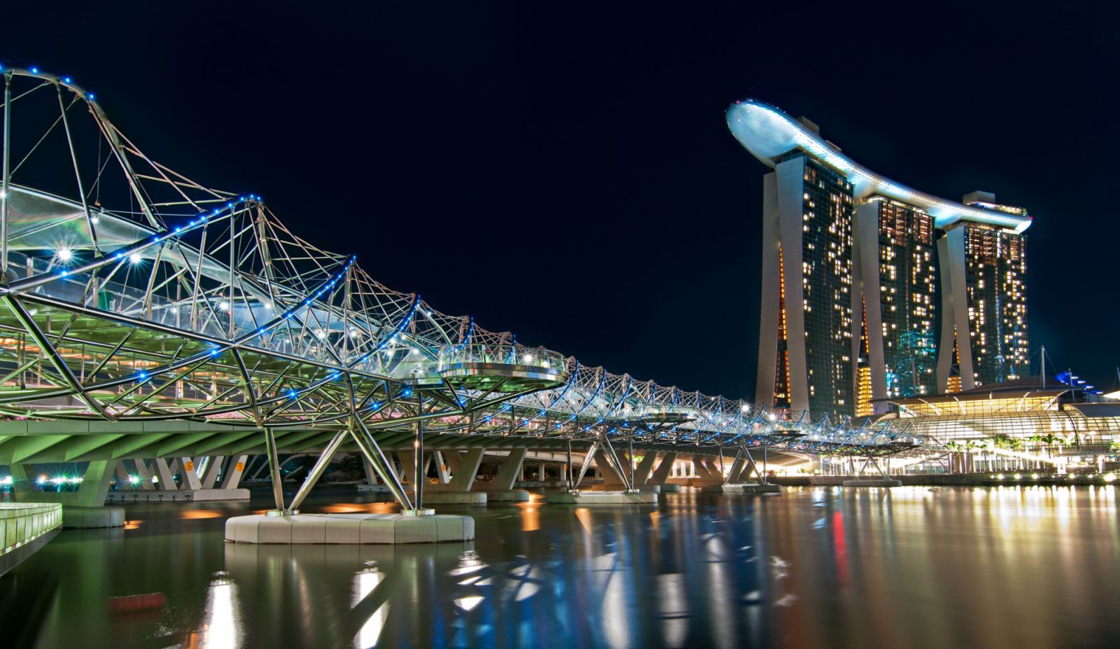 View of Helix bridge in Marina Bay, Singapore at night.